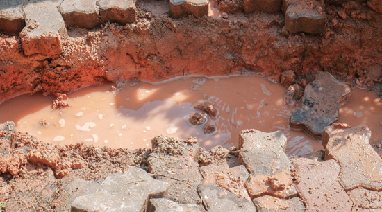 Water main broken by tree root damage in Alpharetta Ga