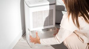 A dehumidifier lowers the humidity in a room or a home