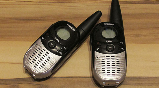 Two way radios in emergency evacuation kits for communication