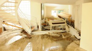 Flooded house with structural and property damage