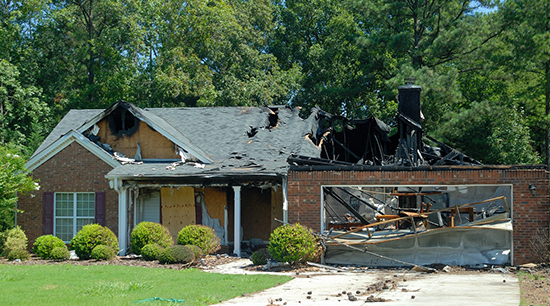 Fire and water damage cause severe structural damages after a house burns