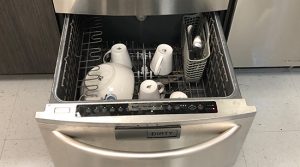 Leaking dishwasher stacked unit idle and open