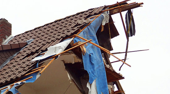 A tree fell on my house during a storm and destroyed my roof