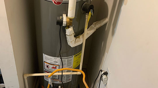 Malfunctioning and leaking hot water heater